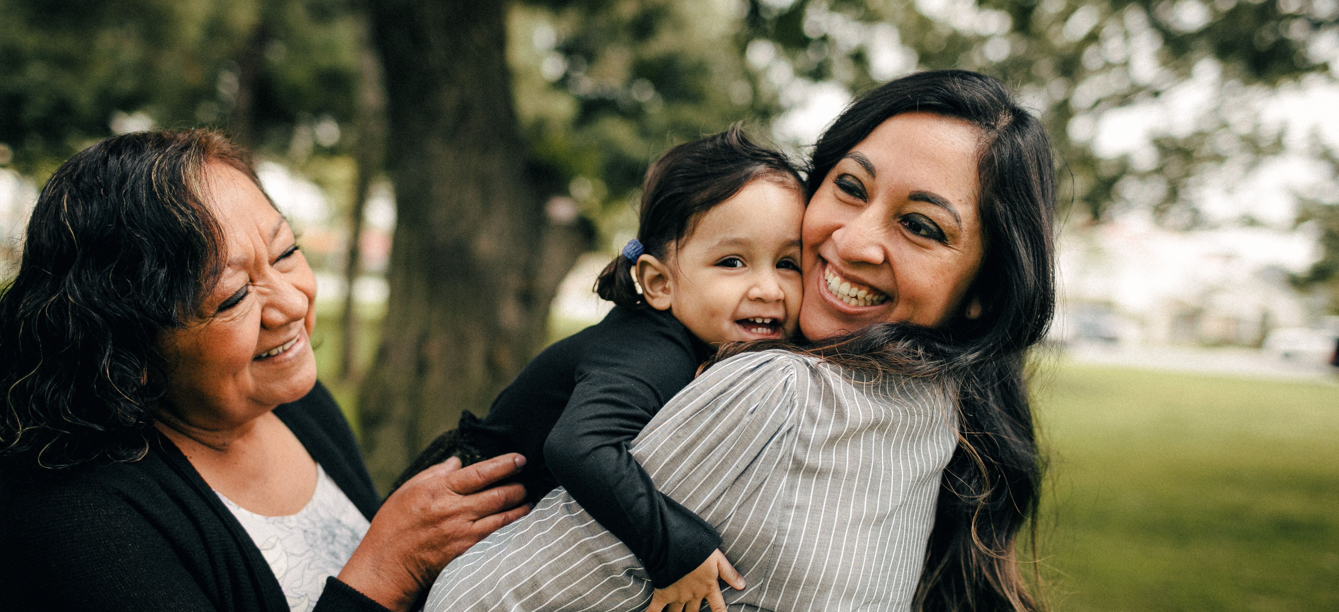 Picture of a mother, child, and grandmother worry-free because they have a will.